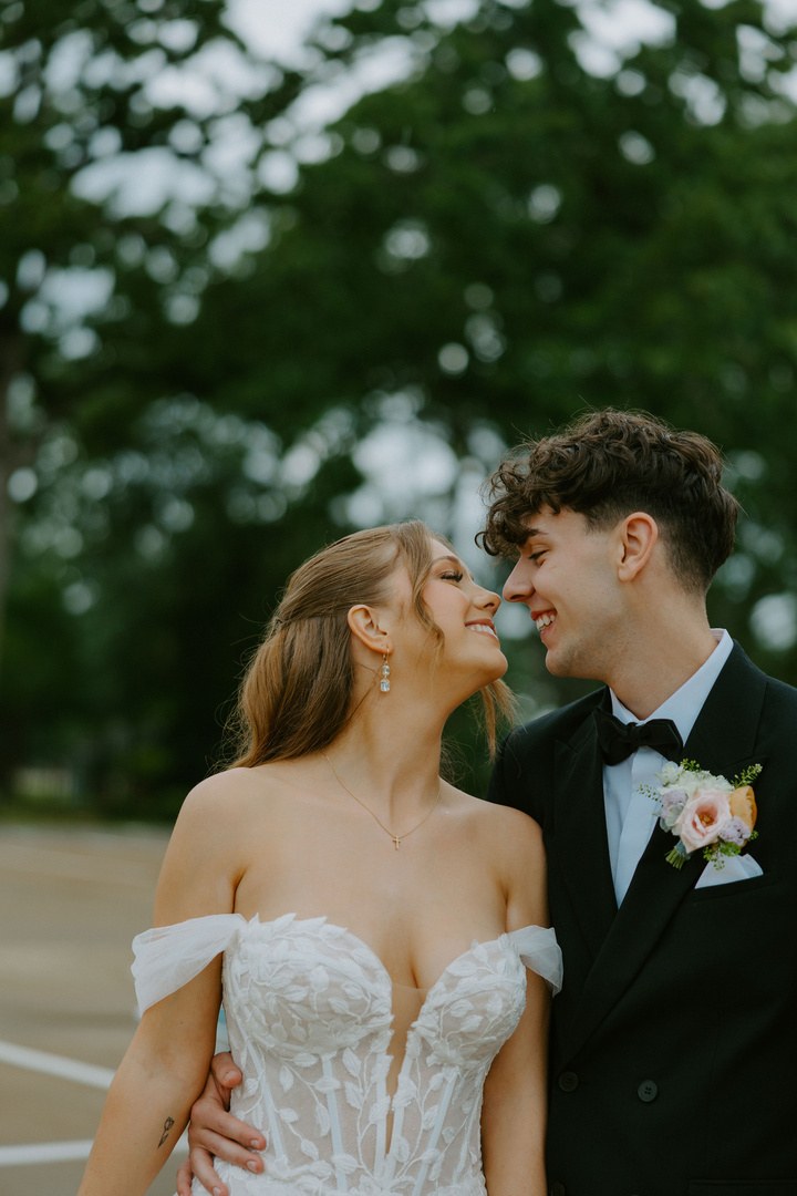 Avery and Timothy embracing outdoors on their wedding day