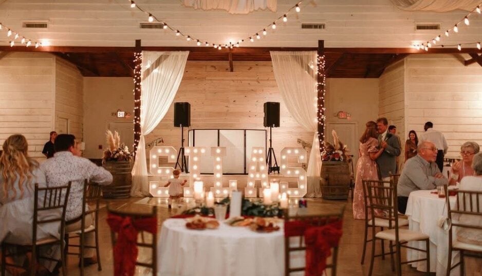 Reception tables at The Berry Barn in burnt orange and boho styling