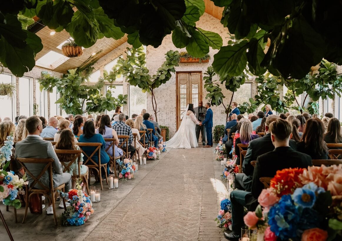Guests seated for Keri and Brandon ceremony at The Greenery