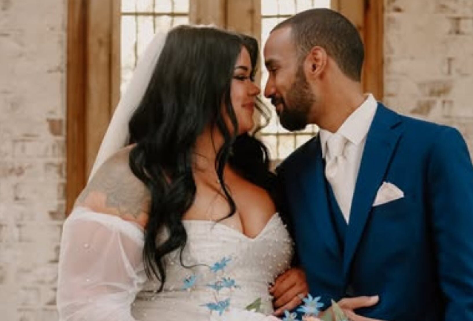 Keri and Brandon sharing a close moment on their wedding day